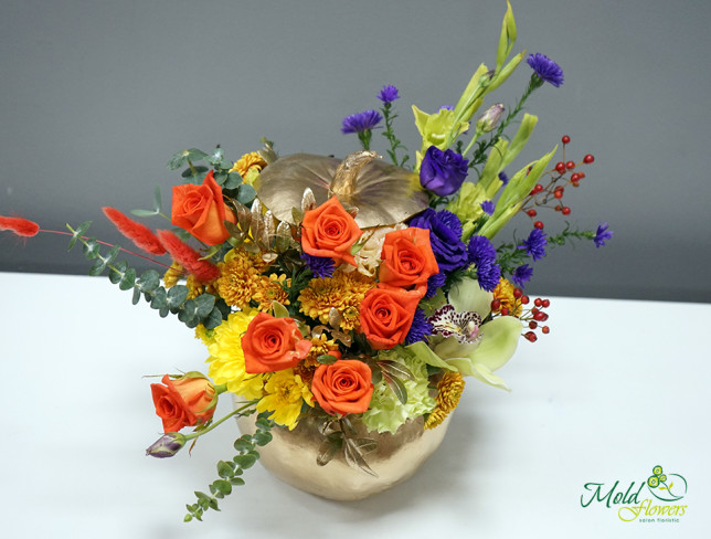 Composition with orange roses, orchids, and carnations with pumpkin photo